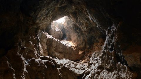 Light Rays Shine inside of Lava Tube Cave - 4K, UHD, Ultra HD resolution