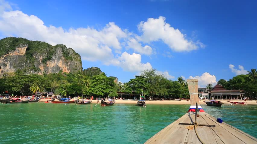 Moving to the Railay beach on thai traditional wooden boat. Krabi, Thailand.