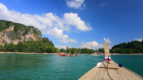 Moving to the Railay beach on thai traditional wooden boat. Krabi, Thailand.