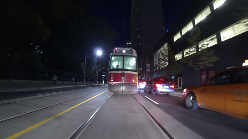 TORONTO, CANADA - SEP 23 2013: Timelapse shot following a Toronto streetcar
