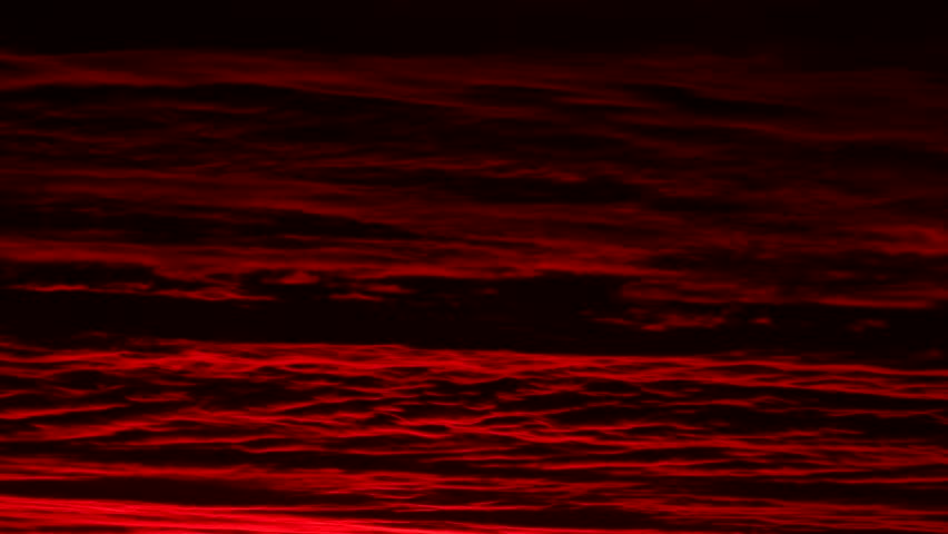 Red Cloud Dawn. Clouds with a red hue during dawn sunrise, shot in time-lapse.