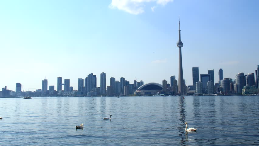 Toronto Skyline Timelapse. Toronto skyline time-lapse on a hazy blue sunny