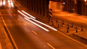 rush of night time traffic on motorway in time lapse scene, Barcelona, Spain