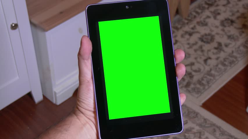 Holding a tablet PC device. Green screen with optional luma matte and corner