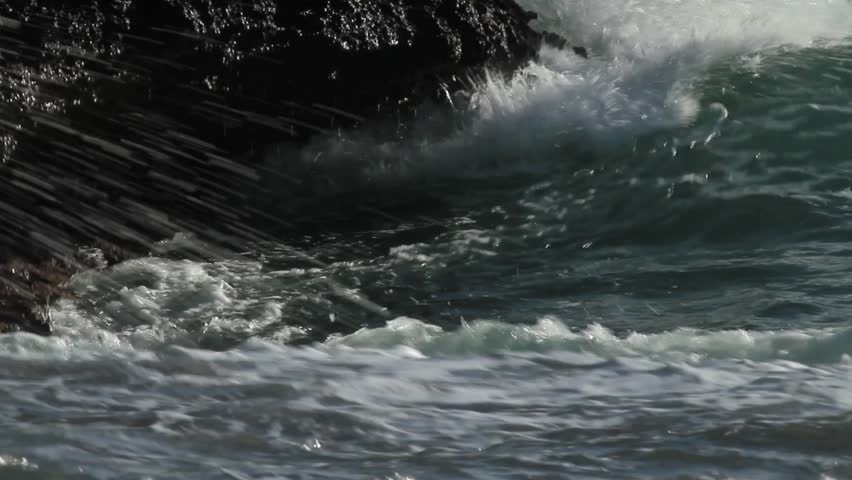 Close-up of Waves crashing against a rocky shore