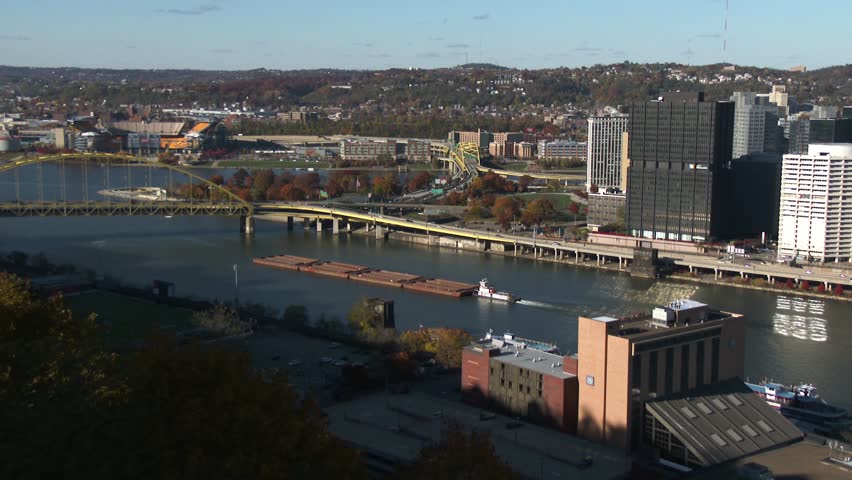 A barge heads up the Monongahela River near Pittsburgh, Pennsylvania. In 4K