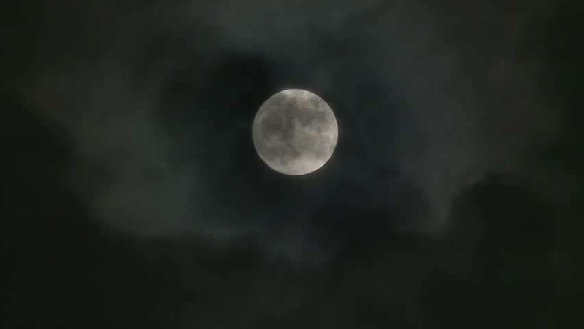 A realtime shot of the full moon on a cloudy night. Not computer generated. In