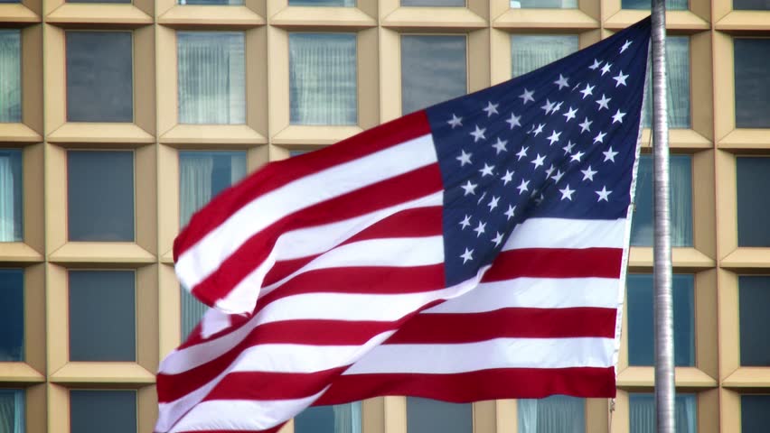 An American flag blowing in the wind in downtown Pittsburgh. In 4K UltraHD.