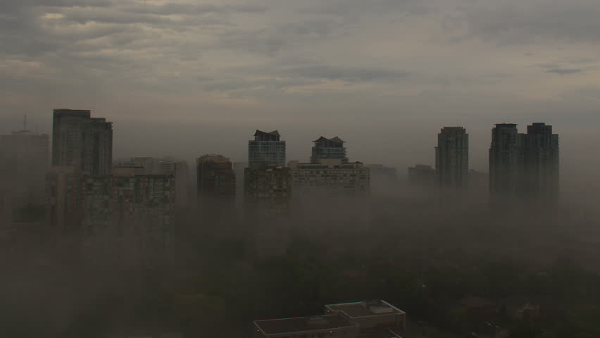 City Fog Clearing Time Lapse. Timelapse shot of a city early in the morning