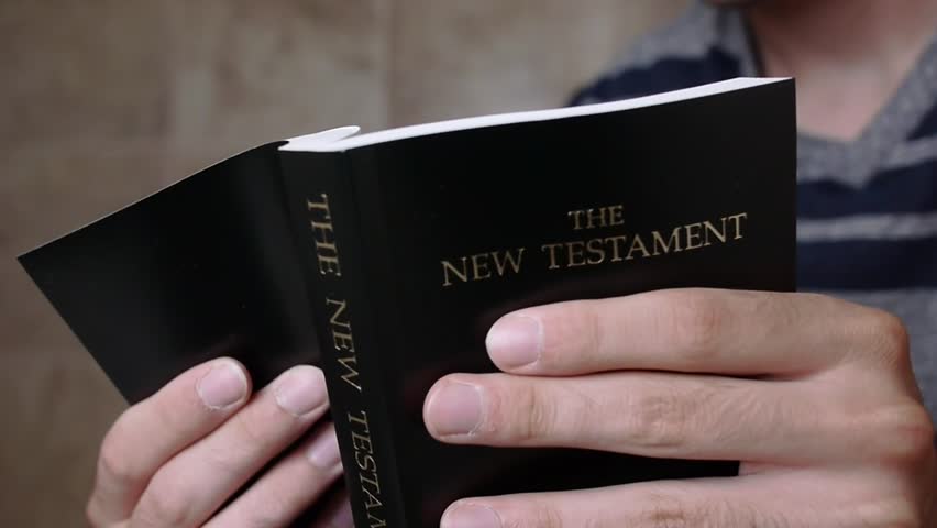 Bible in the hands of a young man