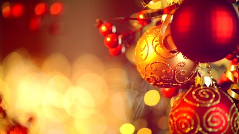 Christmas and New Year Decoration. Hanging Baubles close up. Abstract Blurred Bokeh Holiday Background. Blinking Garland. Christmas Tree Lights Twinkling.