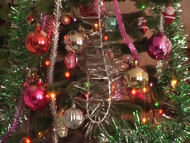 christmas tree decorated with balls in sparkling lights
