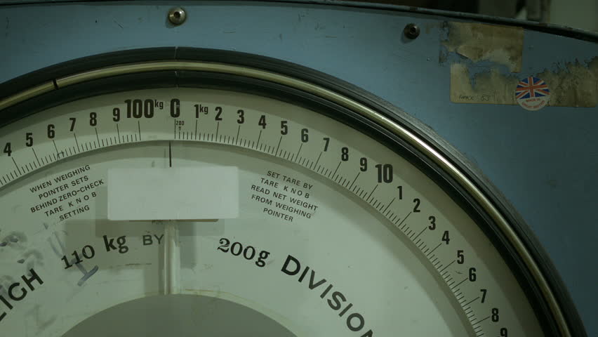 Vintage weighing scales.
Close up shot of a vintage industrial weighing scale.
