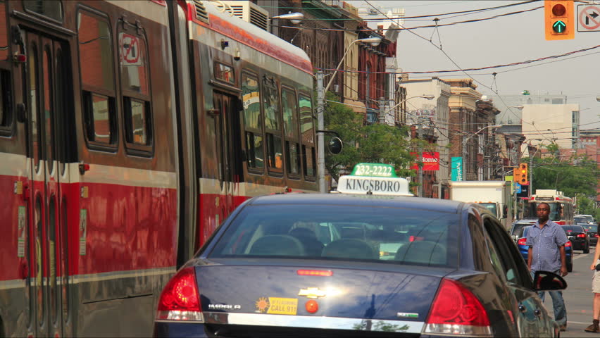 TORONTO - CIRCA JUNE 2012: (Timelapse view) Streetcar and automobile traffic on