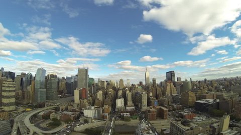 New York City Manhattan looking south towards the Empire State building on a beautiful day with some clouds in the sky. Timelapse.
4K Footage, Quad HD