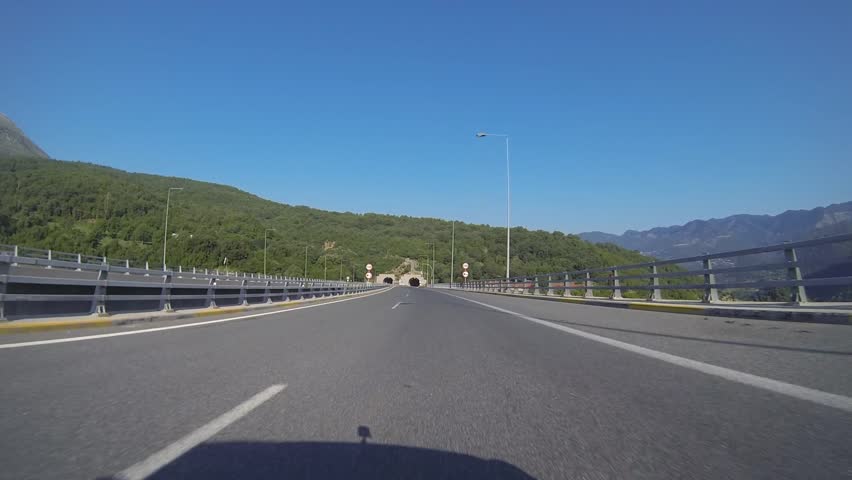 Driving On A Mountain Road With Tunnels In Greece