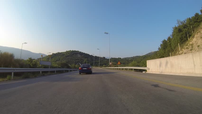 Driving On A Mountain Road With Tunnels In Greece