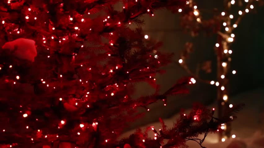 Christmas lights on a tree during the christmas season rack focus