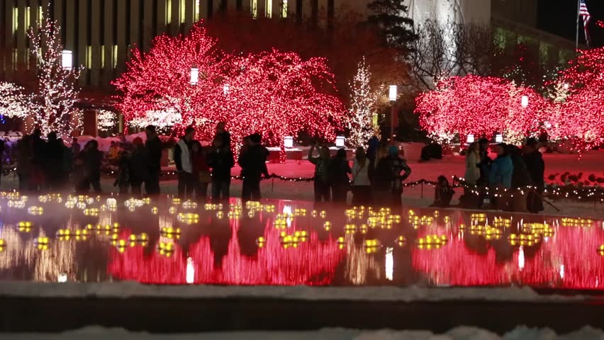 Families enjoying beautiful christmas lights on temple square