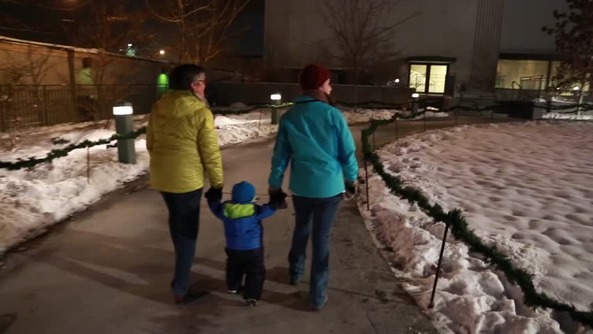 Families enjoying beautiful christmas lights on temple square