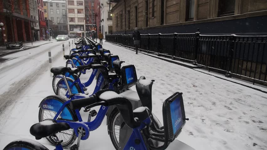 NEW YORK CITY - Circa December, 2013 - A row of unused Citibikes in the snow in