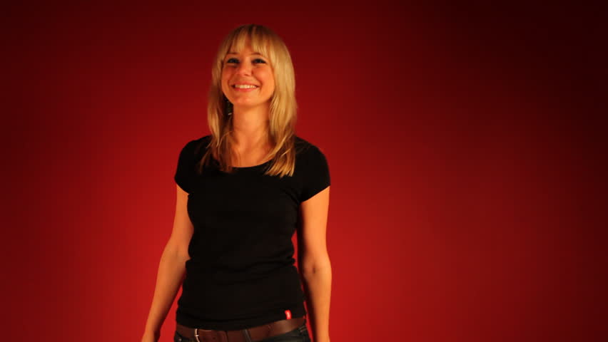 Smiling and dancing blond woman