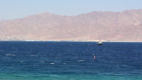 Sea water with Jordan's mountains in the horizon