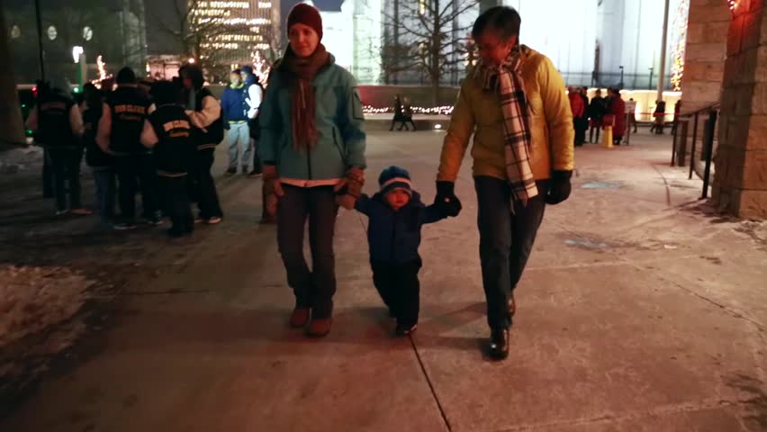 Families walking around the christmas lights at temple square in Salt Lake City
