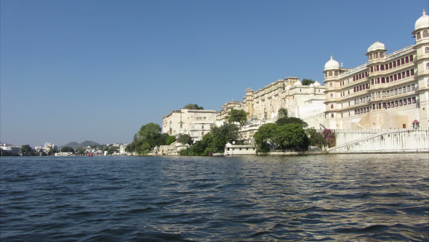 timelapse view from boat on lake and palaces in Udaipur India - 4k