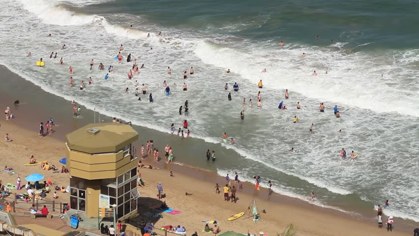 Lifeguard tower and people swimming in the sea at Umhlanga Rocks, Durban, South