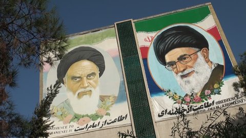 ISFAHAN, IRAN - 22 OCTOBER 2013: The former and current Supreme Leader of Iran (Khomeini and Khamenei respectively) are portrayed on a building in Isfahan, Iran