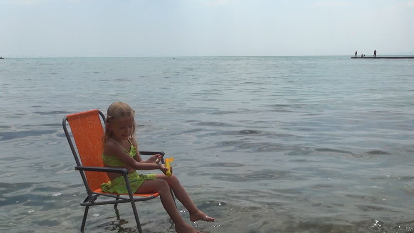 Little Girl Applying Sunscreen Lotion on Beach, Child, Kid, Sun Block, Coastline
