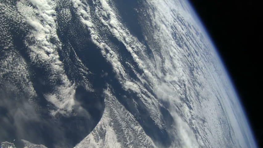 A satellite in orbit flies passes in front of the camera. 

