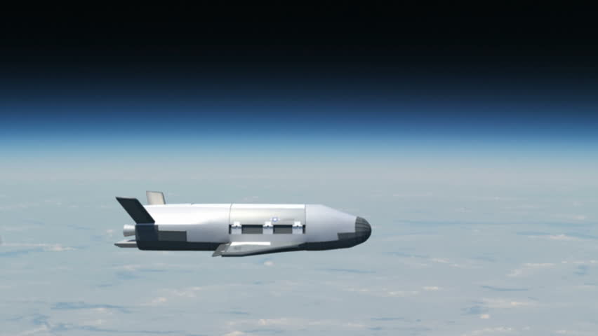 The top secret X-37B Unmanned Spacecraft flying above Earth. 
