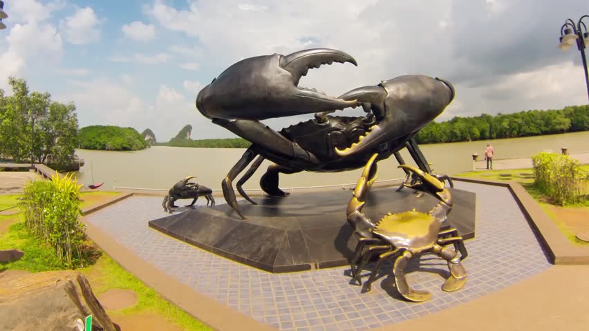 KRABI - CIRCA DECEMBER: Timelapse. statue of crabs in Krabi, symbol of town, on