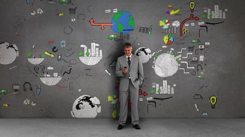 Businessman standing in front of animated business flowcharts on grey wall