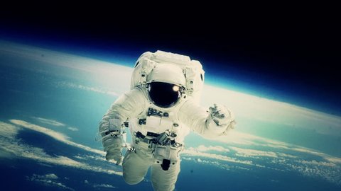 An astronaut stationed at the International Space Station goes on a spacewalk. (Elements furnished by NASA) Video Stok