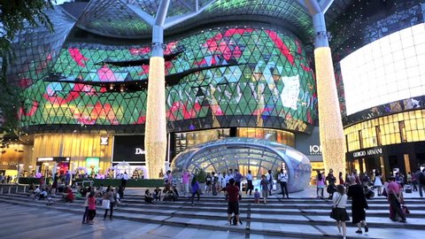 ORCHARD ROAD, SINGAPORE - DEC 19: Time lapse of people at ION Orchard shopping mall and metro entrance on December 19, 2013 in Singapore
