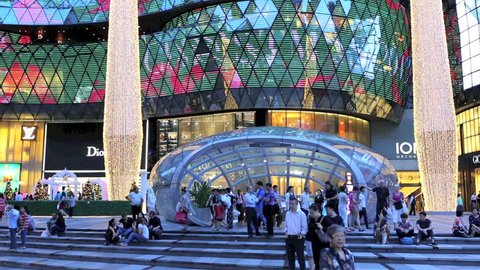 ORCHARD ROAD, SINGAPORE - DEC 19: Time lapse of people at ION Orchard shopping mall and metro entrance on December 19, 2013 in Singapore