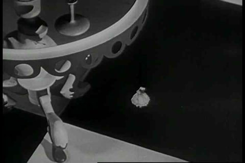 Scenes from a 1950s era stop motion and live action film of Alice and Wonderland.