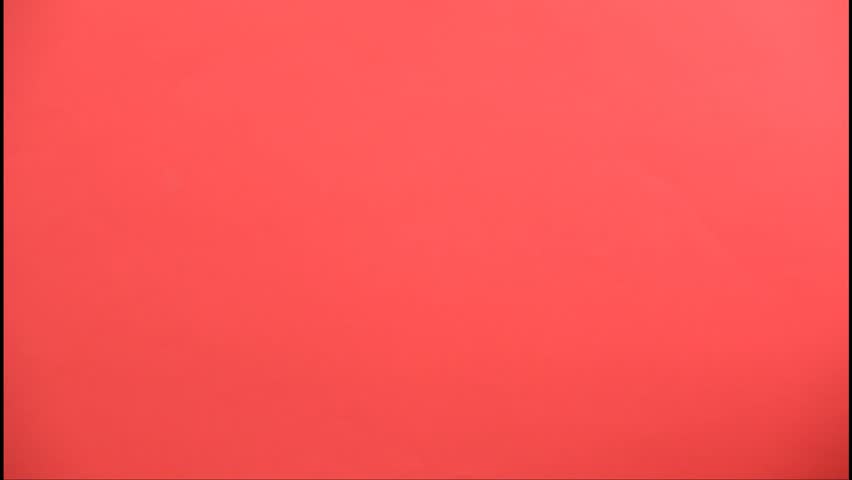 A butler wearing a white glove holding a tray with a bottle