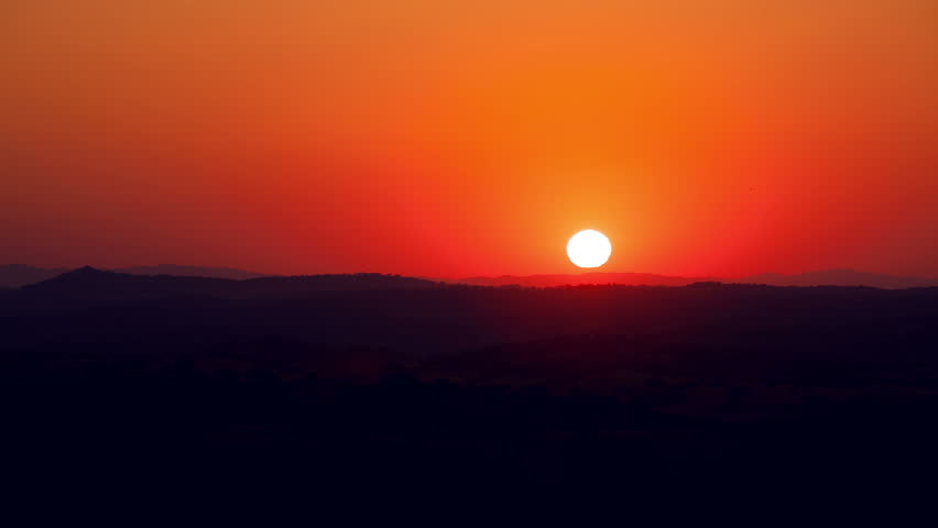 Vibrant Sunrise behind the Mountain, timelapse, 4K UHD