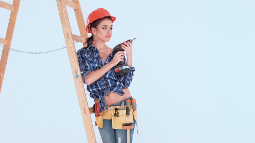 Brunette Girl in Worker Outfit Posing Against Ladder