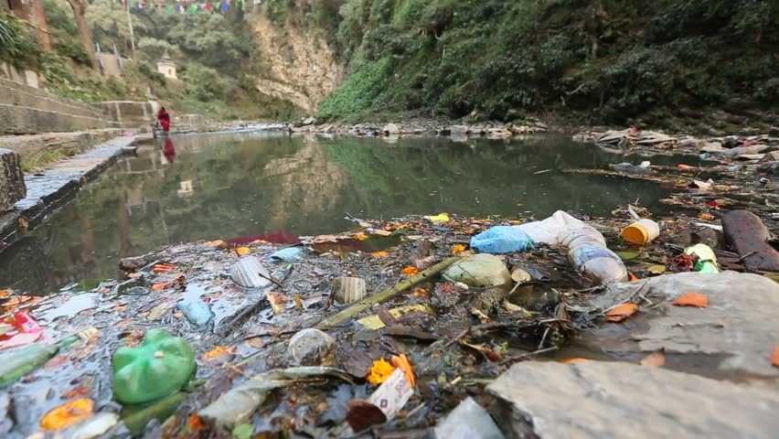 Environmental pollution in the Himalayas. Garbage in the water of river Bagmati.