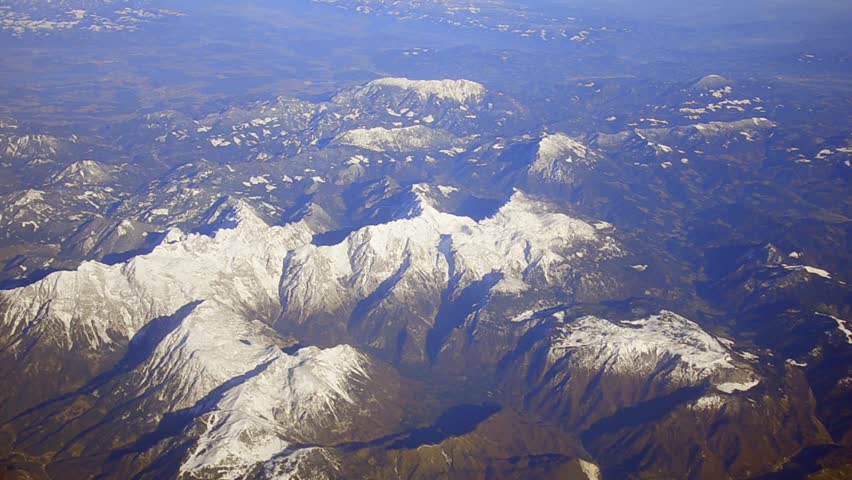 Winter. The Mountain range landscape. Plane point of view. Fly over Alps, Italy,