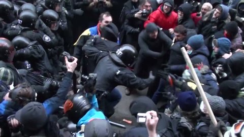 KIEV - DEC 1 2013: Ukraine Kiev. Storming of the presidential administration. Protesters clash with police