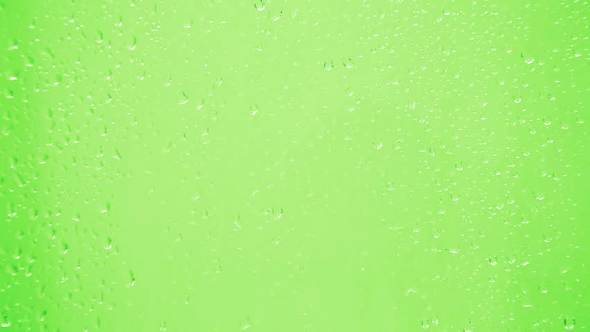 drops on glass - green background
