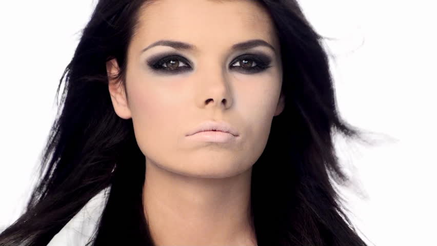 Young beautiful brunette with black scary makeup 