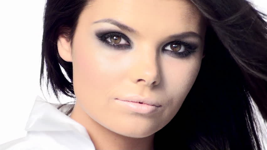 Young beautiful brunette with black scary makeup 