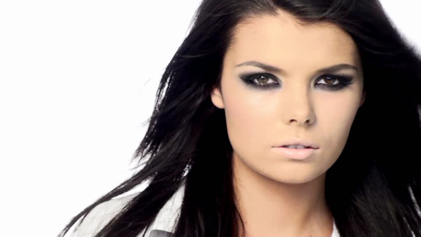Young beautiful brunette with black scary makeup 